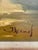 A charming mid-century oil on canvas signed J. Adamos, beautifully presented in a gold-toned wood frame. This warm...