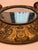 This exceptional antique wall mirror features a heavy brass frame beautifully decorated in relief with classic...