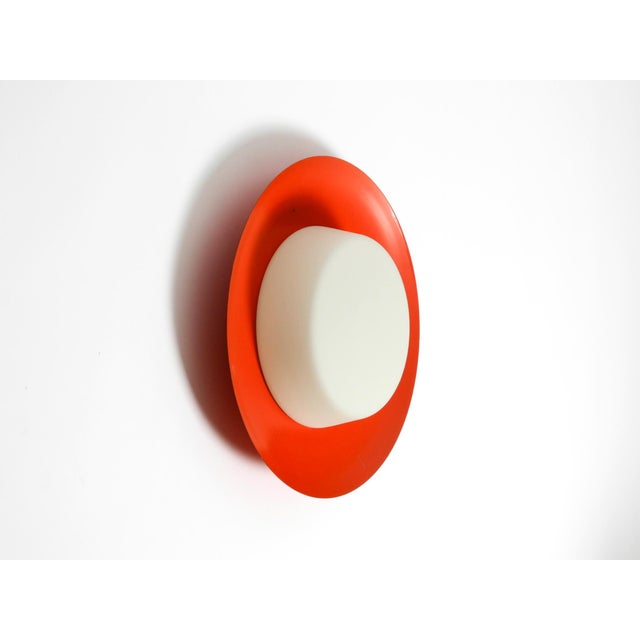 Large mid century wall or ceiling lamp made of glass with a metal reflector in red. great minimalist typical 1950s design....