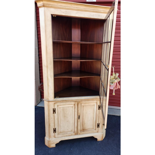 Classic mahogany corner cabinet from Henkel Harris. Cabinet has been professionally painted. Beautiful design and quality...