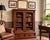 A handsome late 19th-century walnut bookcase dating to the Victorian period, featuring a pair of arched glazed doors above...