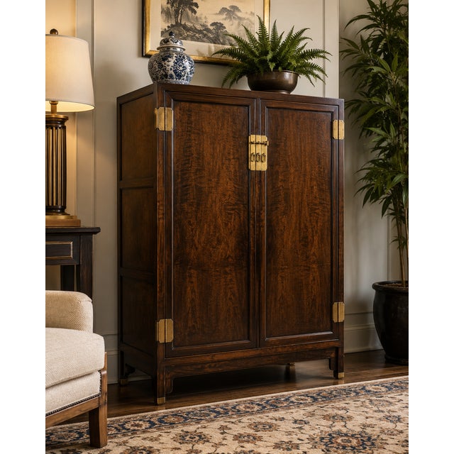A sophisticated vintage cabinet designed by Michael Taylor for Baker Furniture, showcasing the designer’s signature blend...