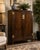 A sophisticated vintage cabinet designed by Michael Taylor for Baker Furniture, showcasing the designer’s signature blend...