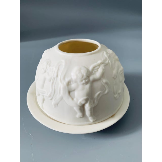 A vintage set of two bisque porcelain votive candle holders in the style of Bernardaud. The tall dome one is about 6"...