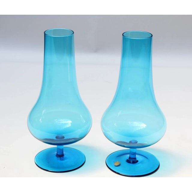Circa 1960s Polish bud vases in striking turquoise with bulbous forms and elegant pedestal bases. Relatively small size:...