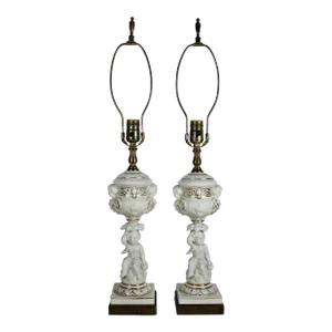 Pair of Mid-Century Parcel-Gilt Porcelain Cherub Form Lamps