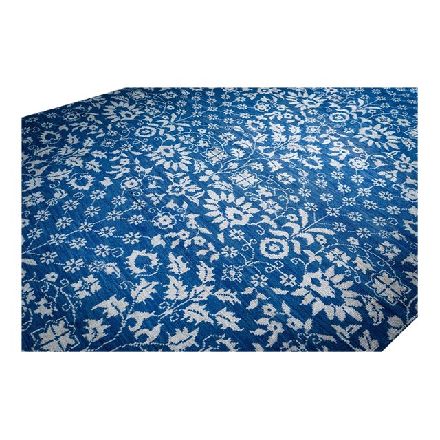 A hand-knotted wool Oushak, made in India and measuring 8' x 10'. Oushak weaving is known for large-scale, softly drawn...