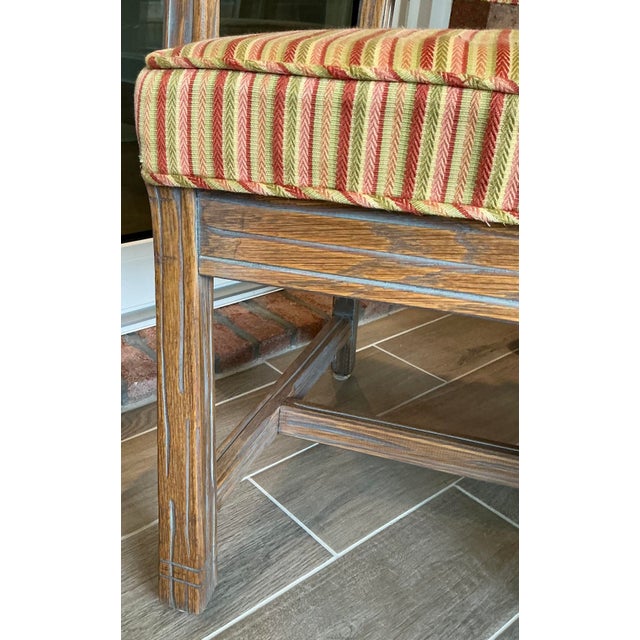 Red oak upholstered diningroom chairs; 2 arm end chairs with removable back cushions and 4 side chairs.. A.B. branded...