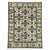 This Chobi wool rug pairs a warm cream field with repeating navy blue motifs and accents of forest green, soft gray, and...