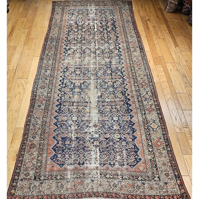 This late 19th century Persian Malayer gallery rug (circa 1875–1900) is a finely handwoven example of village...
