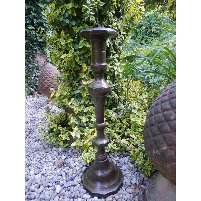 Antique, classic, and solid bronze candlestick; a real eye-catcher even without a candle. Beautiful bronze patina. Candle...