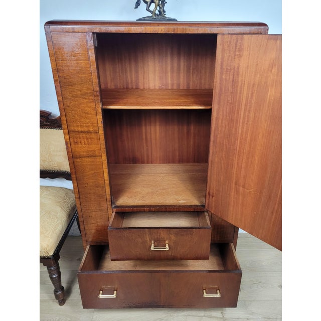 This is a charming Vintage Walnut Tall Boy dresser that would excentuate a mid 20th century bedroom home decor. The tall...
