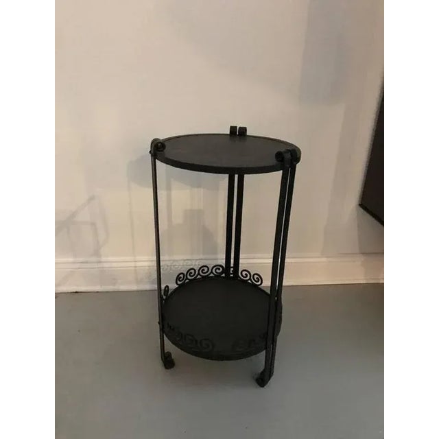 French Art Deco wrought iron side table. Having two tiers with beautiful deco details.