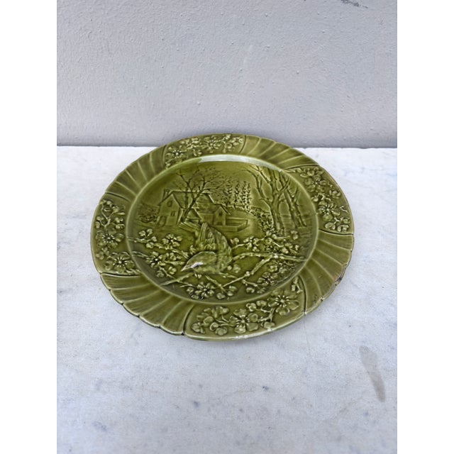 19th Century Green Majolica bird plate signed Sarreguemines. This plate represent the spring with cherries flowers.