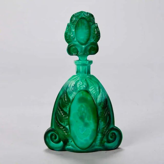 Malachite glass decanter with elaborate, decorative stopper and five matching glasses. Attributed to Heinrich Hoffmann...