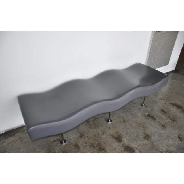 The Undulatus Bench, designed by renowned modernist Stanley Jay Friedman and manufactured by Brueton around 2002. Its...