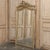An elegant 19th century French Louis XVI transitional mirror, constructed with a wood frame finished in hand-applied gesso...