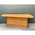 This vintage desk is a bold, sculptural piece, pairing a smooth wooden surfboard top with a solid pedestal wrapped in...