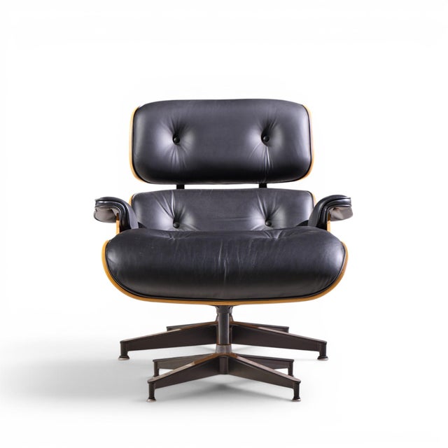 Charles & Ray Eames for Herman Miller Eames Mid Century Walnut Lounge Chair and Ottoman The chair measures: 33 wide x 35...