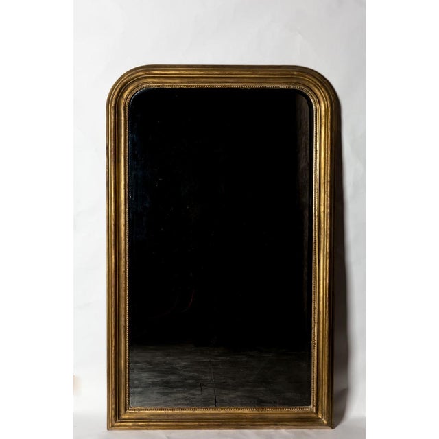 Hand-carved with beaded detail and exquisite aged gilt painting technique, this piece was created in Biarritz, France and...