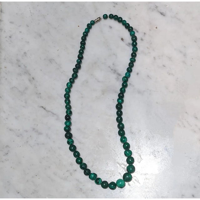 This is part of Chairish’s Costume Jewelry assortment. Solid (no glass beads) hand strung Malachite with clasp. Purchased...