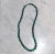 This is part of Chairish’s Costume Jewelry assortment. Solid (no glass beads) hand strung Malachite with clasp. Purchased...