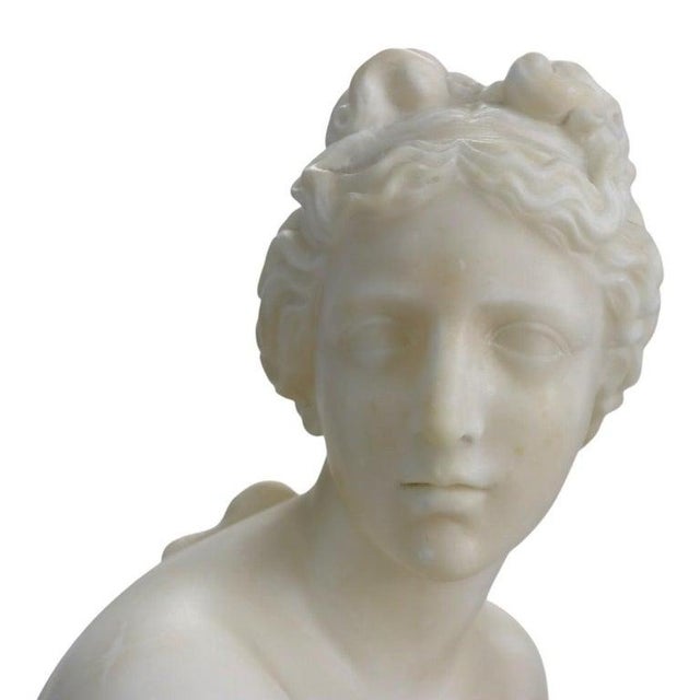This exquisite antique alabaster sculpture masterfully renders the classical subject of the "Crouching Venus," a pose...