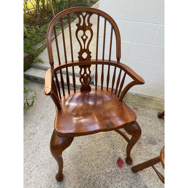 Classic set of 6 heavily grained English Windsor dining chairs featuring high hoop-backs with spindled designs and pierced...