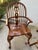 Classic set of 6 heavily grained English Windsor dining chairs featuring high hoop-backs with spindled designs and pierced...