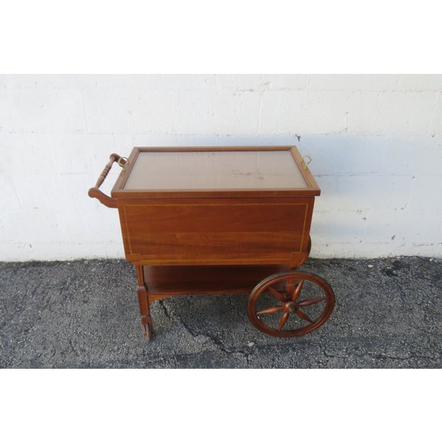 This classic Tea Cart is made of wood, solid wood, mahogany, veneer, and glass. The Cart has a traditional style and...