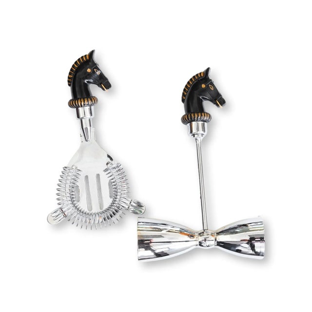 Set of Midcentury Horse's Head Bar Tools. Crafted in England, this 2-piece ensemble includes a double jigger and a...
