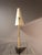 Table lamp, model Style number 1213, by J. T. Kalmar, Vienna. Black cast iron base, brass arm, lacquered lampshade....