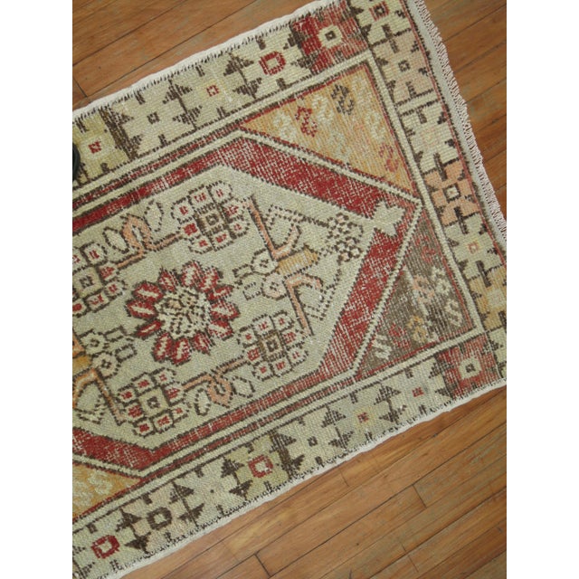 One of a kind, mid 20th-century Hand-knotted Turkish runner with a tribal medallion and border design. Professionally...