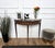 Very elegant and refined Italian Mid-Century Modern design demi lune console side table. Standing on four typically shaped...