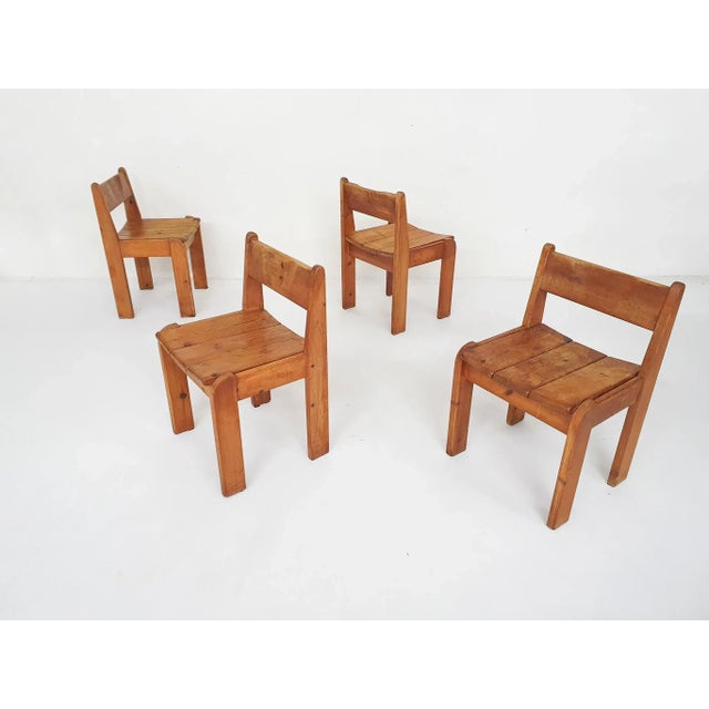 Solid pinewood dining chairs by Ate van Apeldoorn. We aslo have a matching pinewood dining table available. Chairs are in...