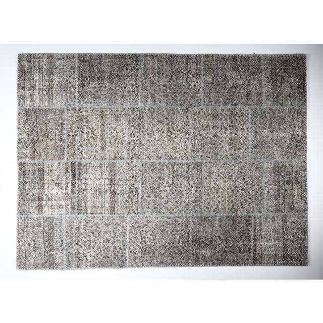 This beautiful vintage patchwork rug is a one of a kind handmade piece, created from carefully selected fragments of...