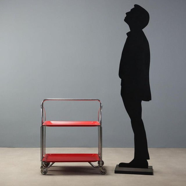 Dinette' serving cart produced by Bremshey Gerlinol in the 1960s, a classic of mid-century functional design. Featuring a...