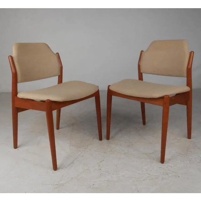 Teak Danish modern six-leg table and eight matching chairs by Arne Vodder for Sibast. Measure: Oval table expands from 78"...