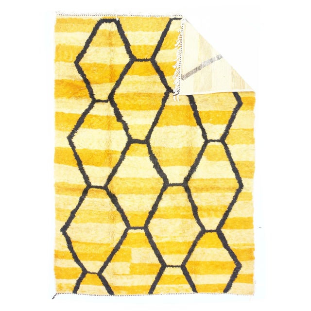 Vintage Moroccan Rug 6’9" x 9’7". The 16 point round medallion of this finely woven Qum urban silk carpet suspends two...