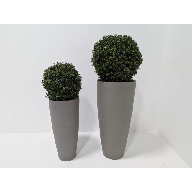 The clean and contemporary styling of the Dax Tall vase planter elevates indoor and outdoor greenery for a greater eye...