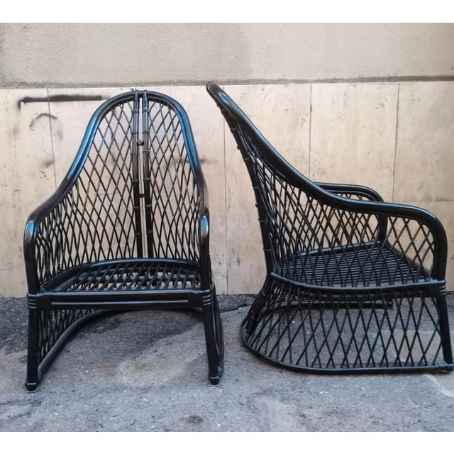 Pair of foreign black armchairs with vintage 1970s top seat cushion Comfortable, unique and with a very particular design...