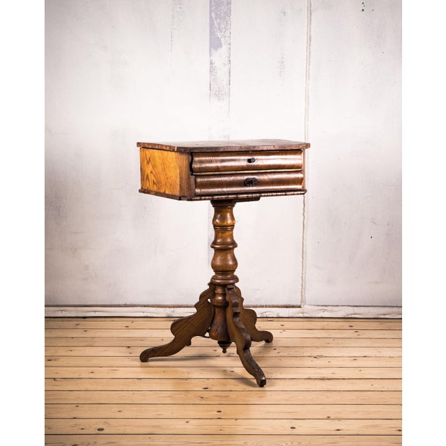 This sewing table dates from the second half of the 19th century and combines classic design with practical functionality....