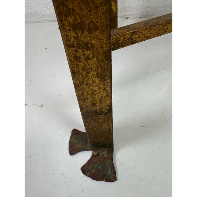 This is a mid-century vintage hand wrought iron gilded chest on stand. This chest features a domed top with two handles on...