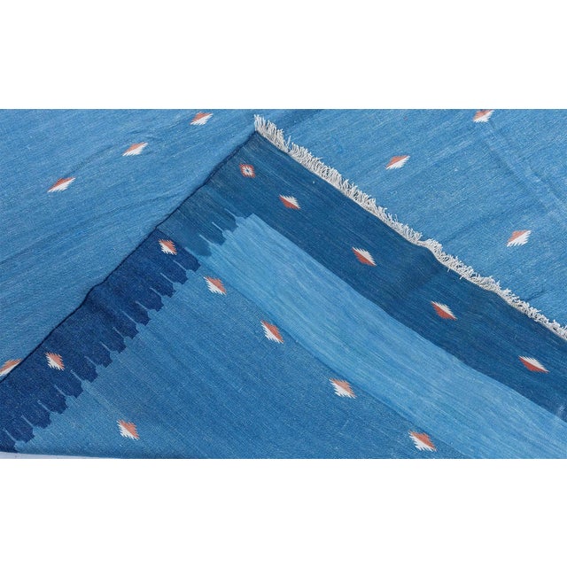 This vintage 1955 Indian Dhurrie rug is a refined example of mid-century flat-weave design, where traditional...