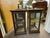 Pair of Victorian Display cabinets. Antique wood and glass display with velvet shelf, mirror back.. Door opening in back....