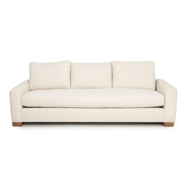 Vanguard White Upholstered Three-Seat Sofa, with three cushions and Vanguard Furniture label. 34" H x 103" W x 40" D;...