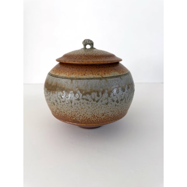 Gorgeous studio stoneware pottery jar with knobbed lid. Striking and distinctive wood ash glaze creates earthy textures...