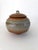 Gorgeous studio stoneware pottery jar with knobbed lid. Striking and distinctive wood ash glaze creates earthy textures...