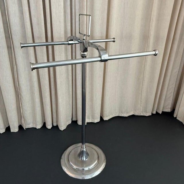 This beautiful American Art Deco, freestanding, chromed steel, double pole garment rack is futuristic, Machine-Age design...