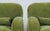 A handsome pair of oversized lounge chairs upholstered in luxurious olive green suede, combining the relaxed comfort of...